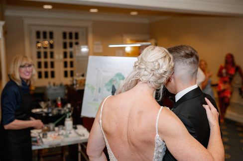 couple's reaction to seeing live wedding painter