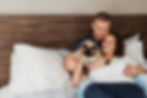 in home session with couple on bed with cat