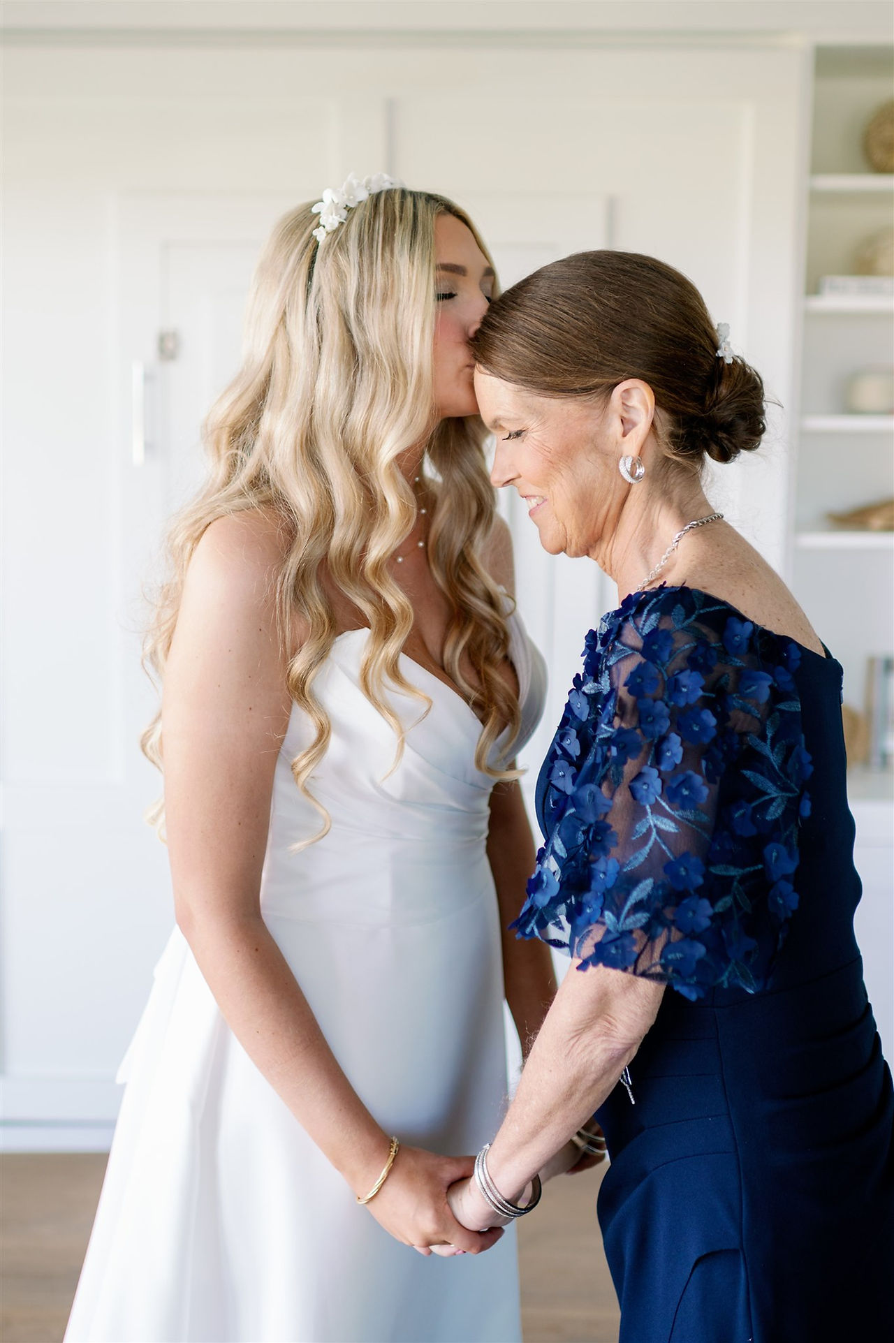 bride and mom share a moment