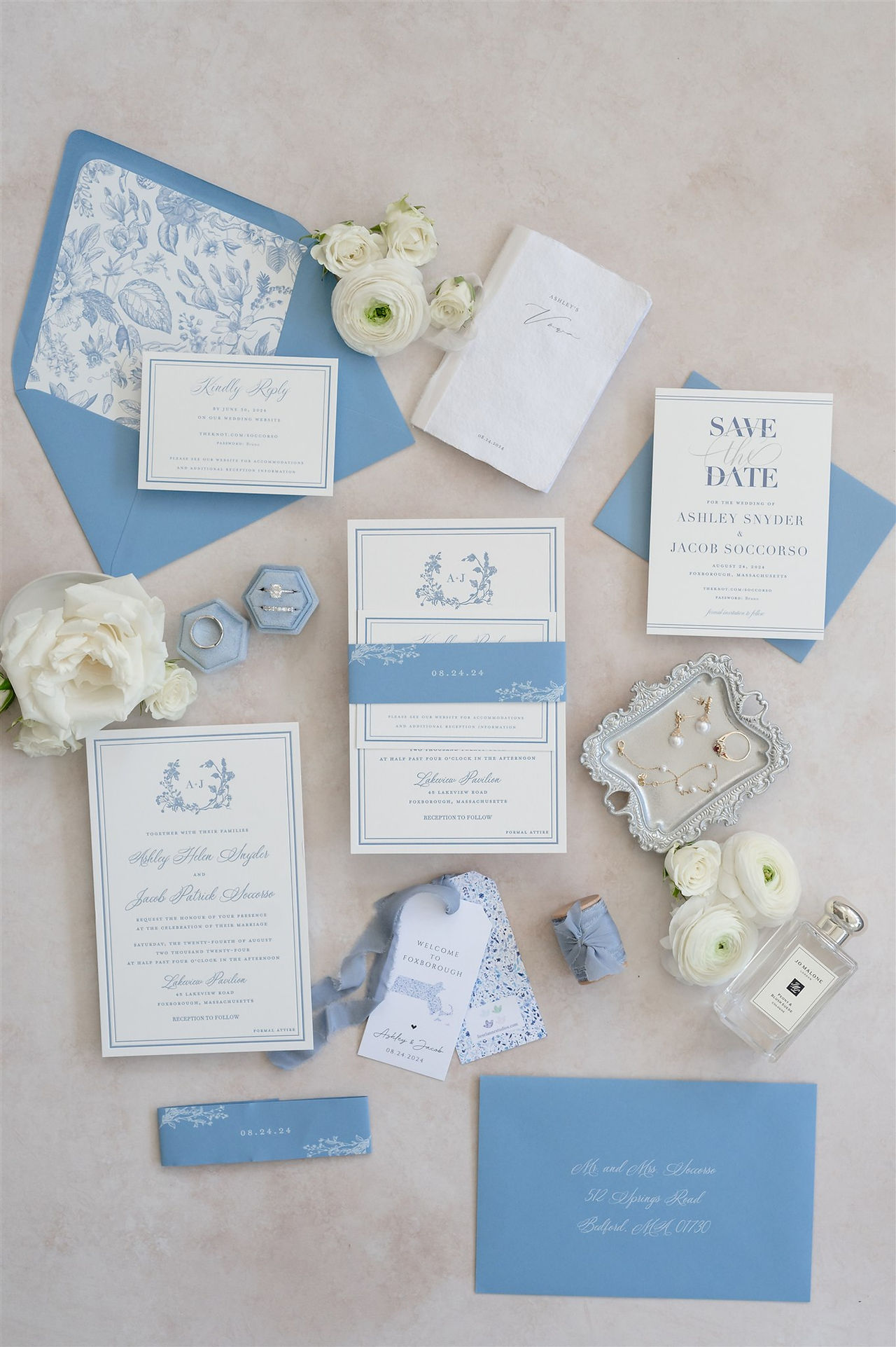 flat lay of wedding invitations and details designed by sans serif designs