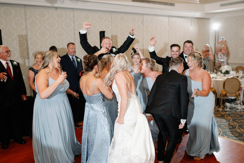 fun wedding party entrance into reception space