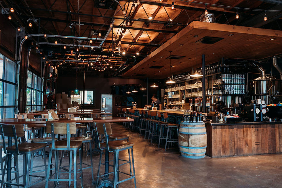 Elopement at Lazarus brewery in Austin. Inside of Lazarus Brewery showing the rustic bar and Edison lightbulbs in bar