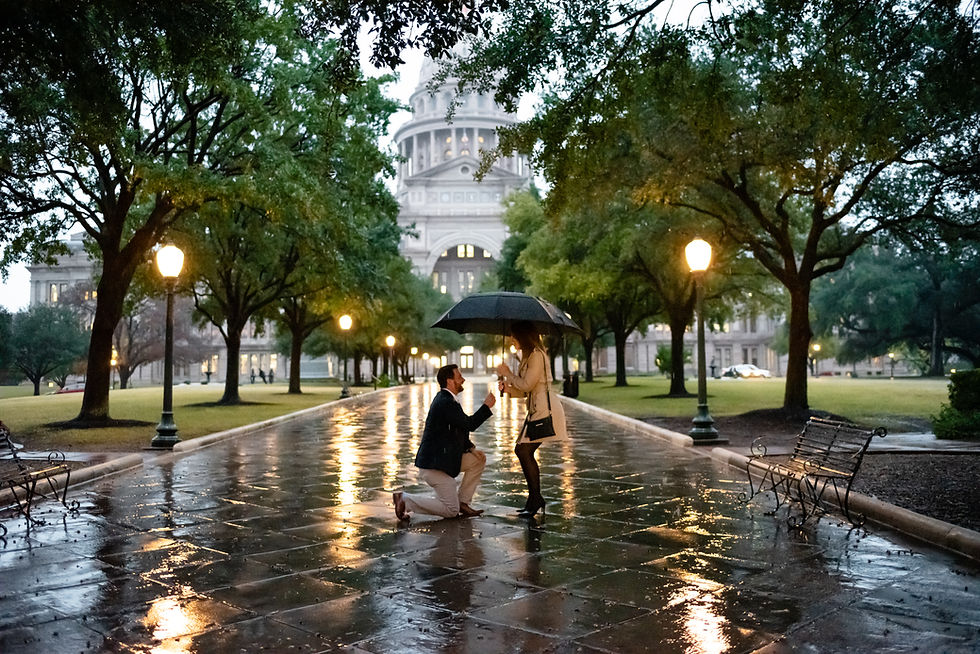 man down on knee during proposal in front of the Austin Capitol building