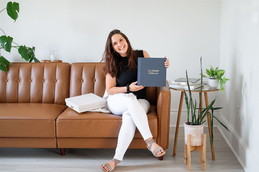 photographer holds wedding album