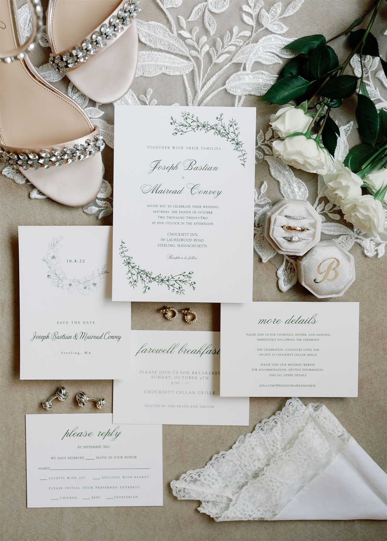 wedding flat lay with invitation and jewelry