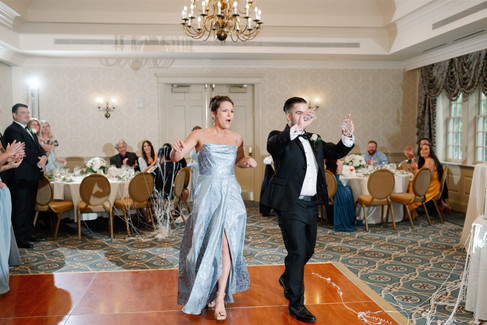 fun wedding party entrance into reception space