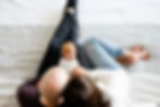 in home newborn session with viewpoint above parents on bed