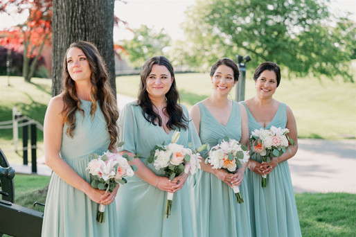 Bridesmaids during outdoor summer ceremony at the Squantum Association