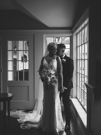 moody black and white photo with window light in lobby of inn on boltwood in amherst