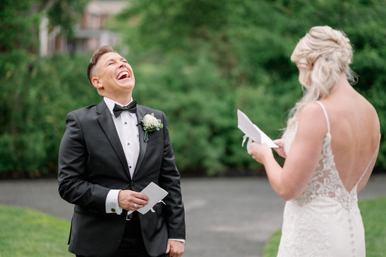 bride laughing listening to vows
