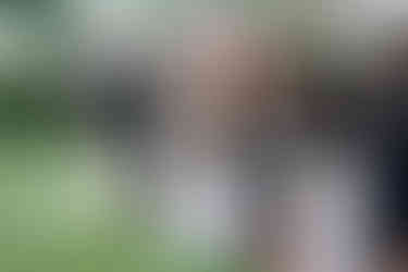 bride high-fiving flower girl during recessional