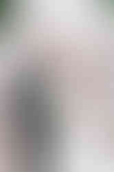 couple laughing on roof of inn on boltwood with fireplace as backdrop