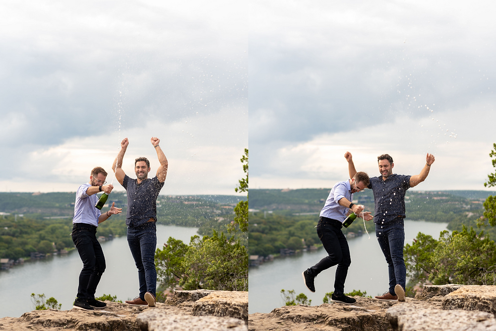 couple sprays champagne in celebration after getting engaged