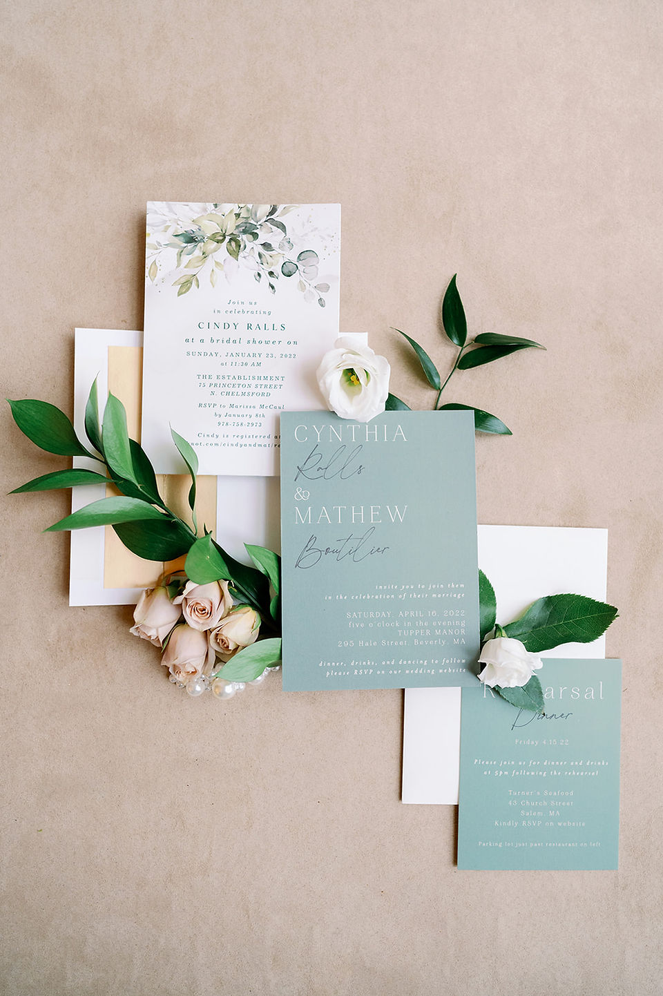 wedding detail flat lay with invitation