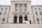 bride's dress blowing in the wind on the steps of the providence state house