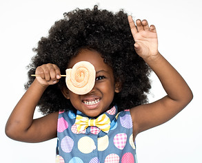 little-girl-smiling-happiness-studio-portrait-sweet-lollipop.jpg