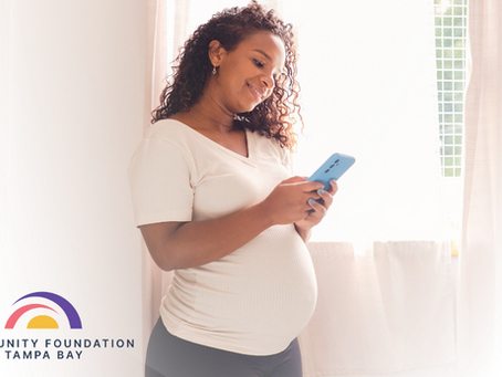 Pregnant woman on telehealth appointment on her phone