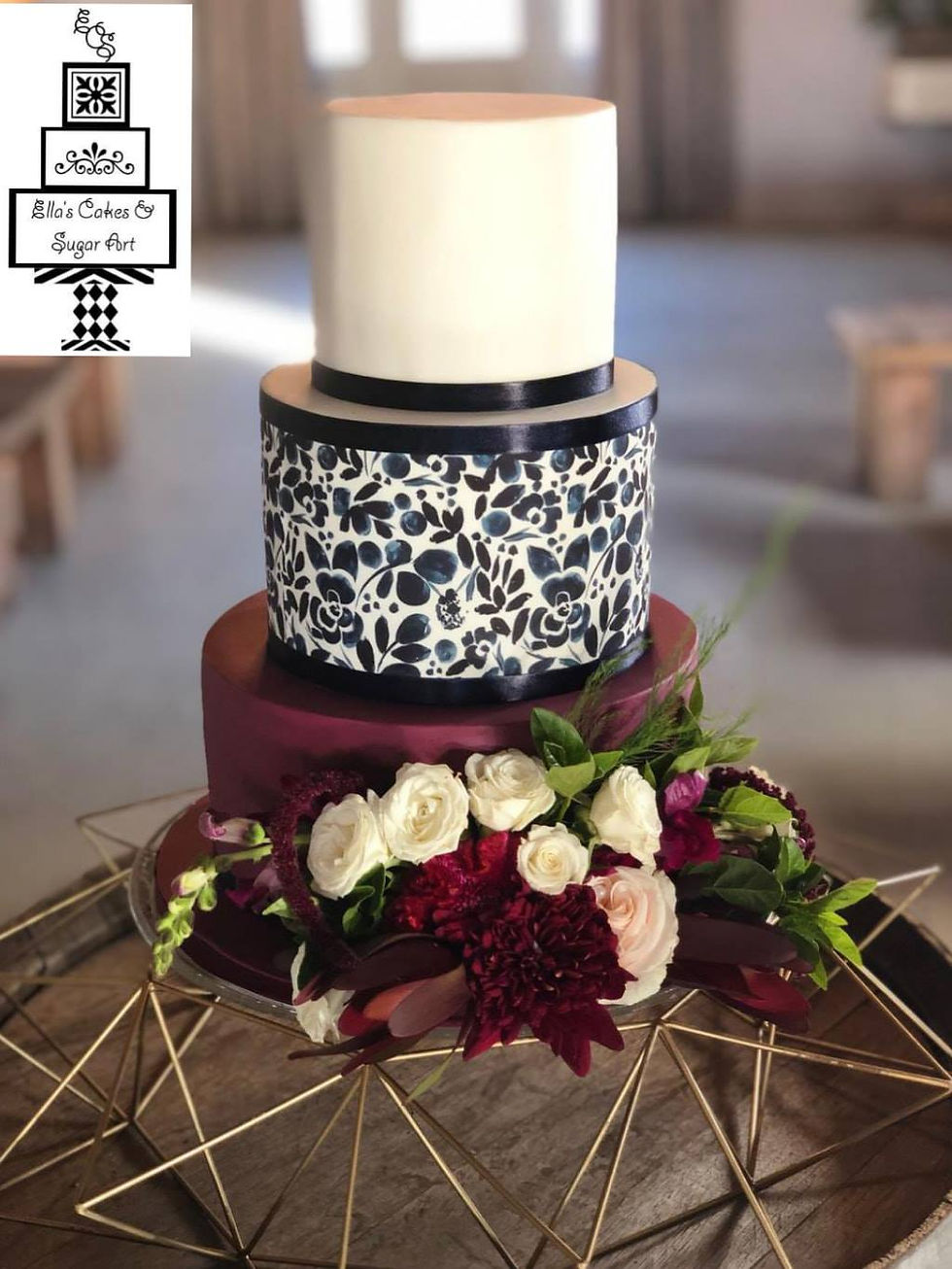 Navy plum and white wedding cake with fr