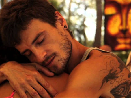 Gay and queer men sharing a moment of connection and intimacy during a Men’s Hearts gay tantra retreat in Europe, exploring brotherhood, conscious relationships, meditation and personal growth.
