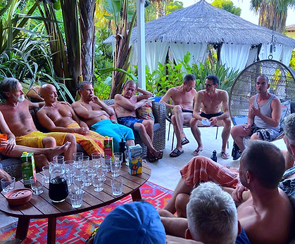 Group of men sharing a moment outdoors during a tantra for men retreat in Spain, gay tantra community, connection, relaxation and brotherhood