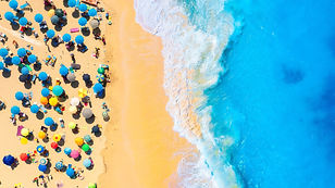 Aerial view on the beach, people and umbrellas Vacation and adventure Beach and blue water
