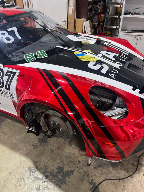 Porsche GT4 RS wrap and paint protection film installation in progress.