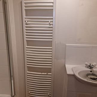 2nd image of white tall towel rail 