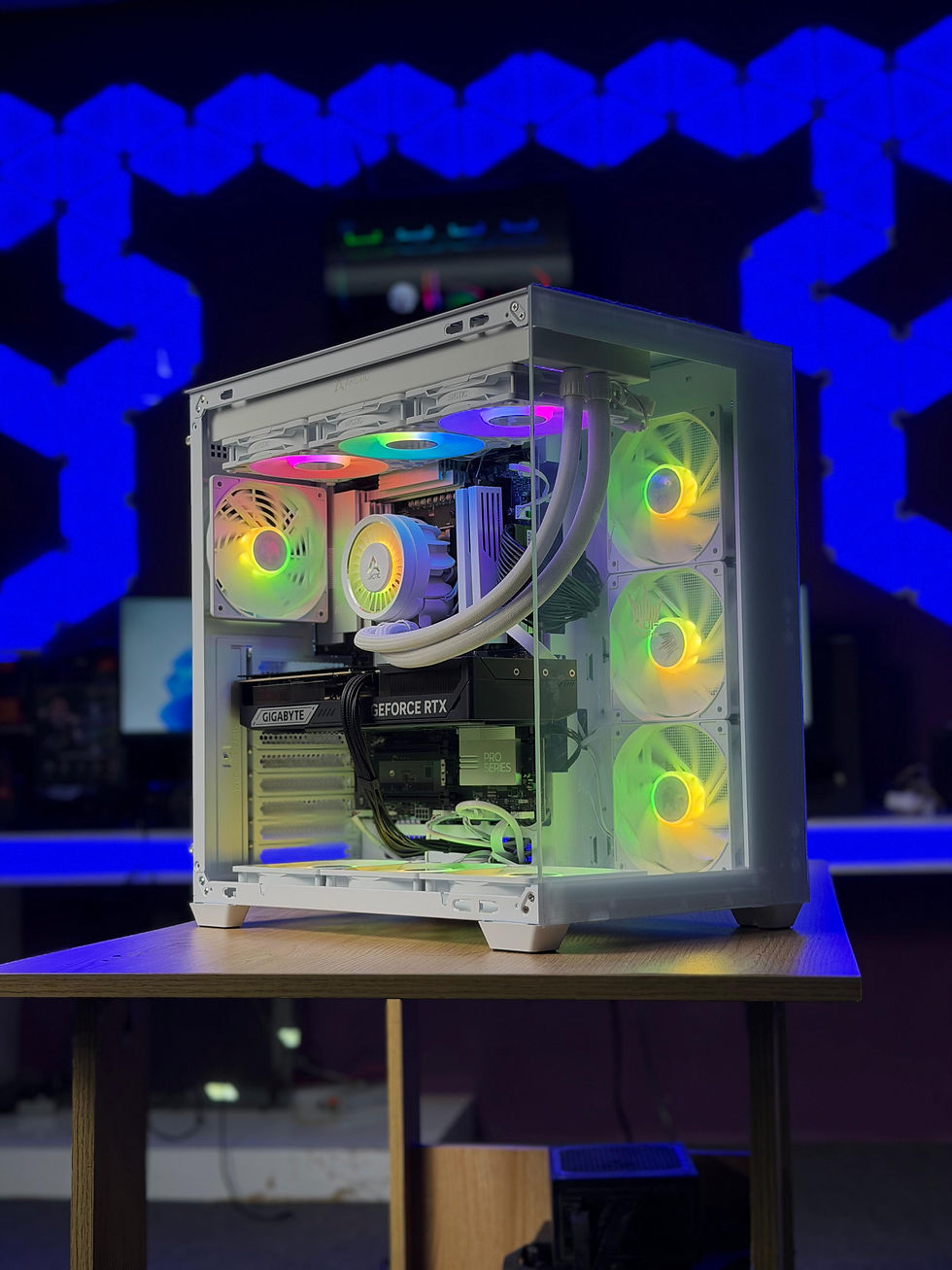 Thumbnail: Completed all-white custom gaming PC build sitting on a wooden desk highlighting unified styling, clean cable management, and