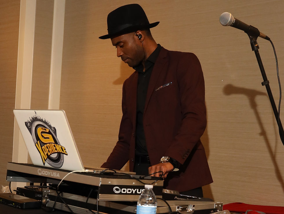 Close-up view of DJ hands adjusting sound mixer controls