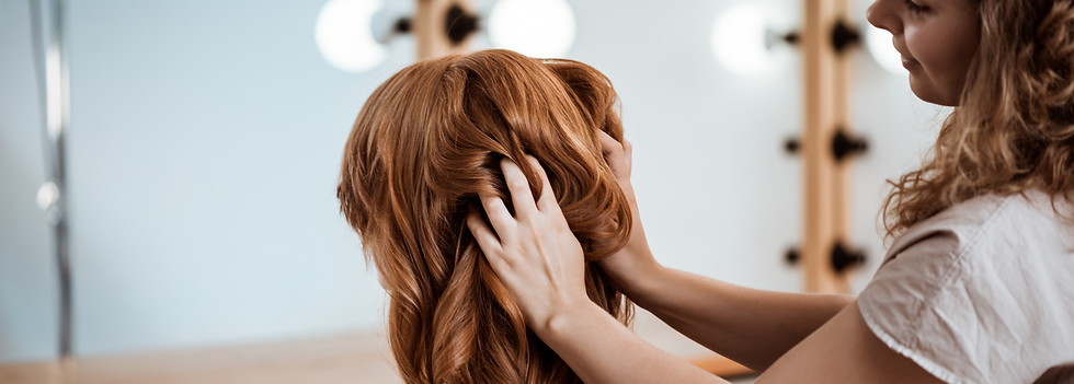 female-hairdresser-making-hairstyle-redhead-woman-beauty-salon.jpg