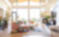 living room with tall windows