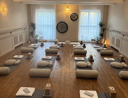 Yogi Sanctuary studio laid out with mats and props ready for a class.