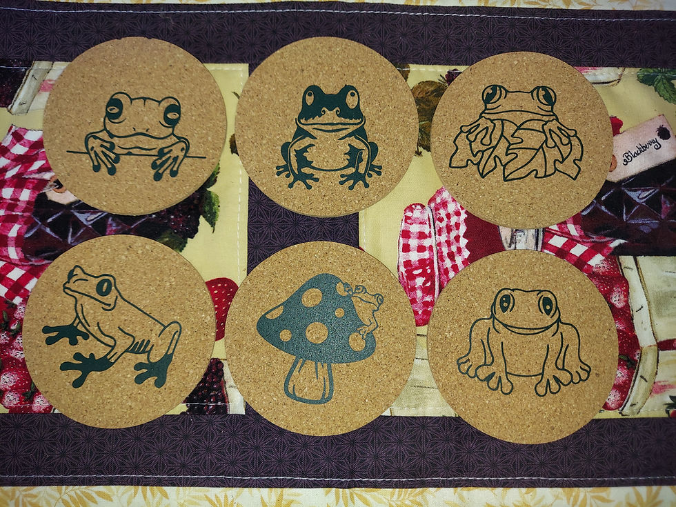 Six Fynniroo cork coasters with a frog theme.