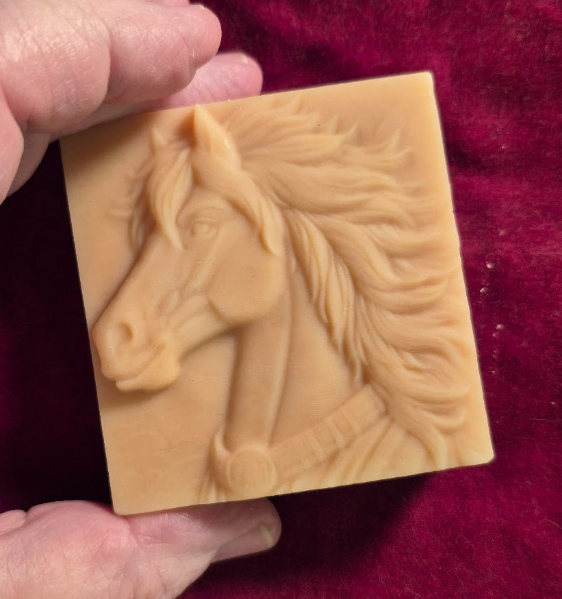 A beautiful image of a horse head on a square bar of soap.