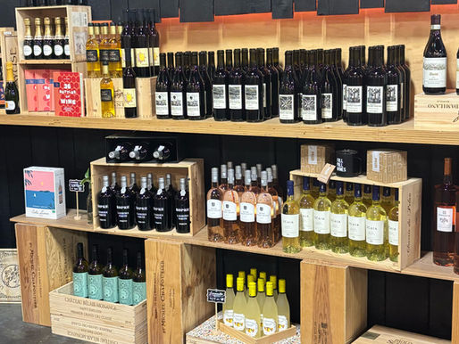 Shelves of carefully curated boutique wines inside Full Pull Wines' Seattle tasting room and pickup warehouse in SoDo