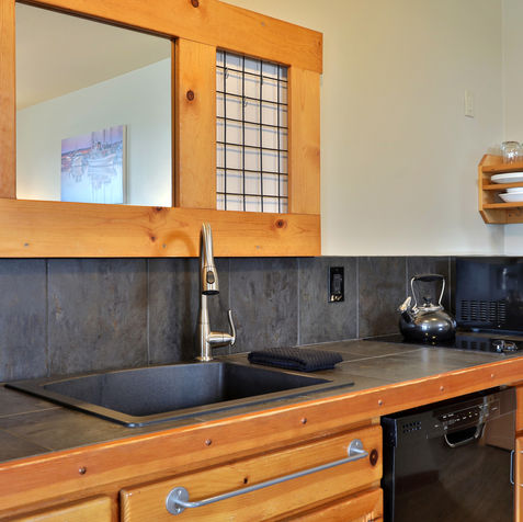 Walk-in shower with locally sourced personal care products in the Whidbey Island studio
