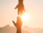 two hands reaching for each other