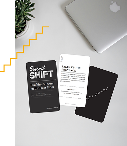 Several cards from the Retail Shift training program card deck are arranged on a desk next to a closed Macbook and succulent plant. The image is accented with an illustrated outline of multi-level steps.