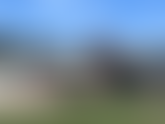 exterior view of the Casco Township Hall, a metal and brick building