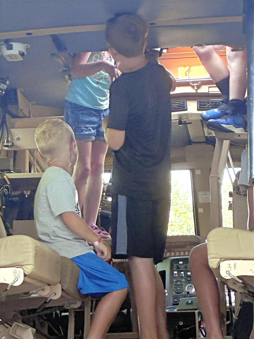 Kids examine SWAT truck features