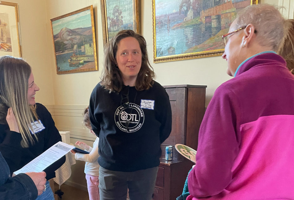 Out on the Lakeshore Exec Dir Jennifer Evans, center, talks with LWWC President Judy Graff (r)