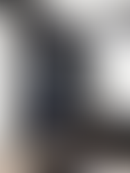 Tailored joinery in a home office featuring a navy bookcase, desk and traditional moulding.