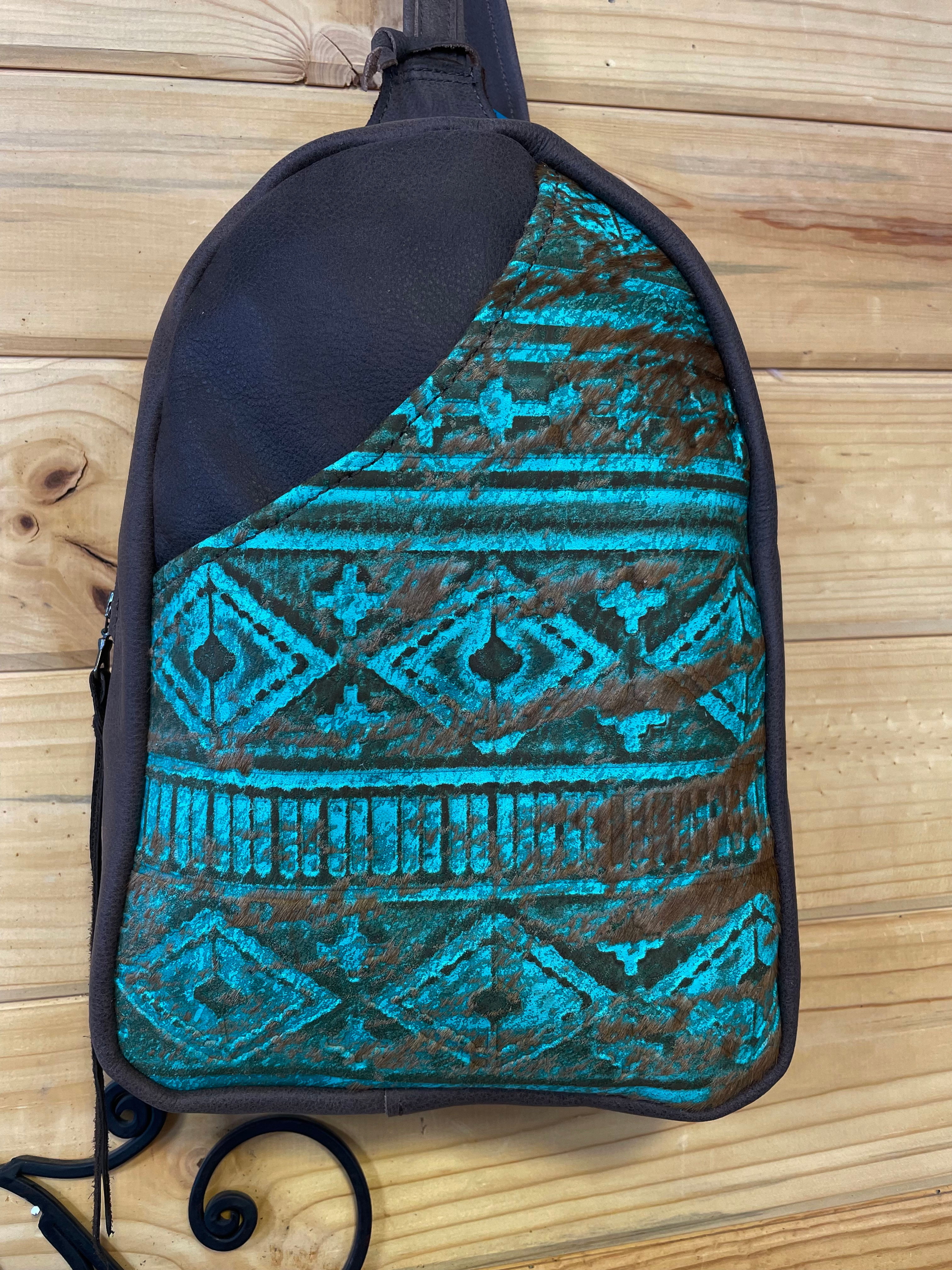 #14. Embossed turquoise and brown leather sling bag