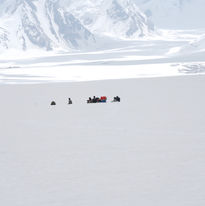 Porters cross Hispar La on Snow Lake Trek