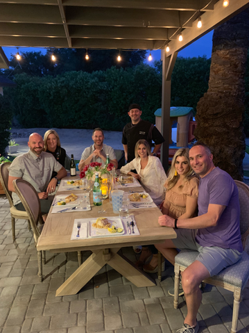 Couples enjoying a romantic dinner prepared by Chef Turner, featuring beautifully plated gourmet dishes in an intimate dining setting.