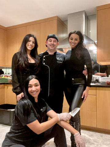 Chef Turner with her culinary team posing together.