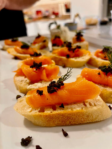 Plated meal of bread and fish, featuring a simple and freshly prepared food presentation.