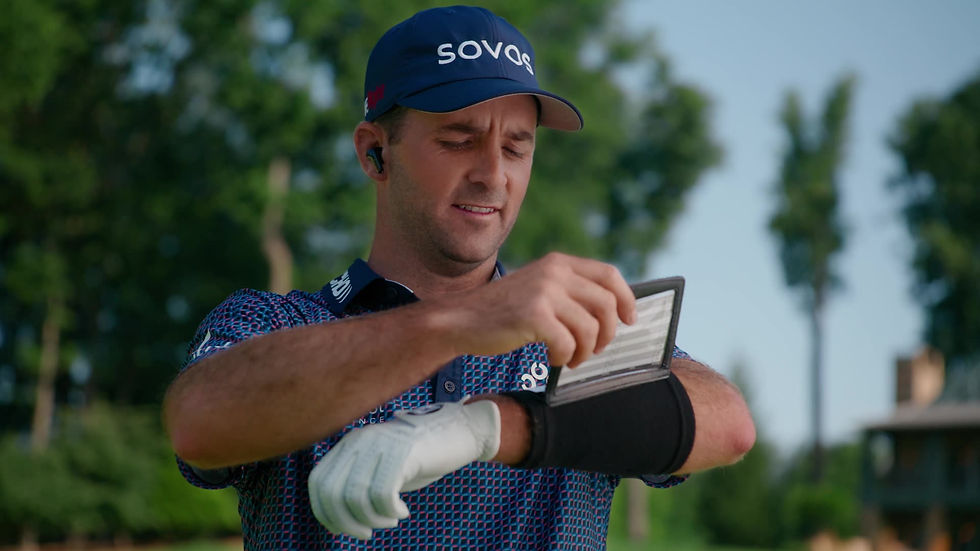 PGA Tour golfer Denny McCarthy reviews course information on a wearable display.