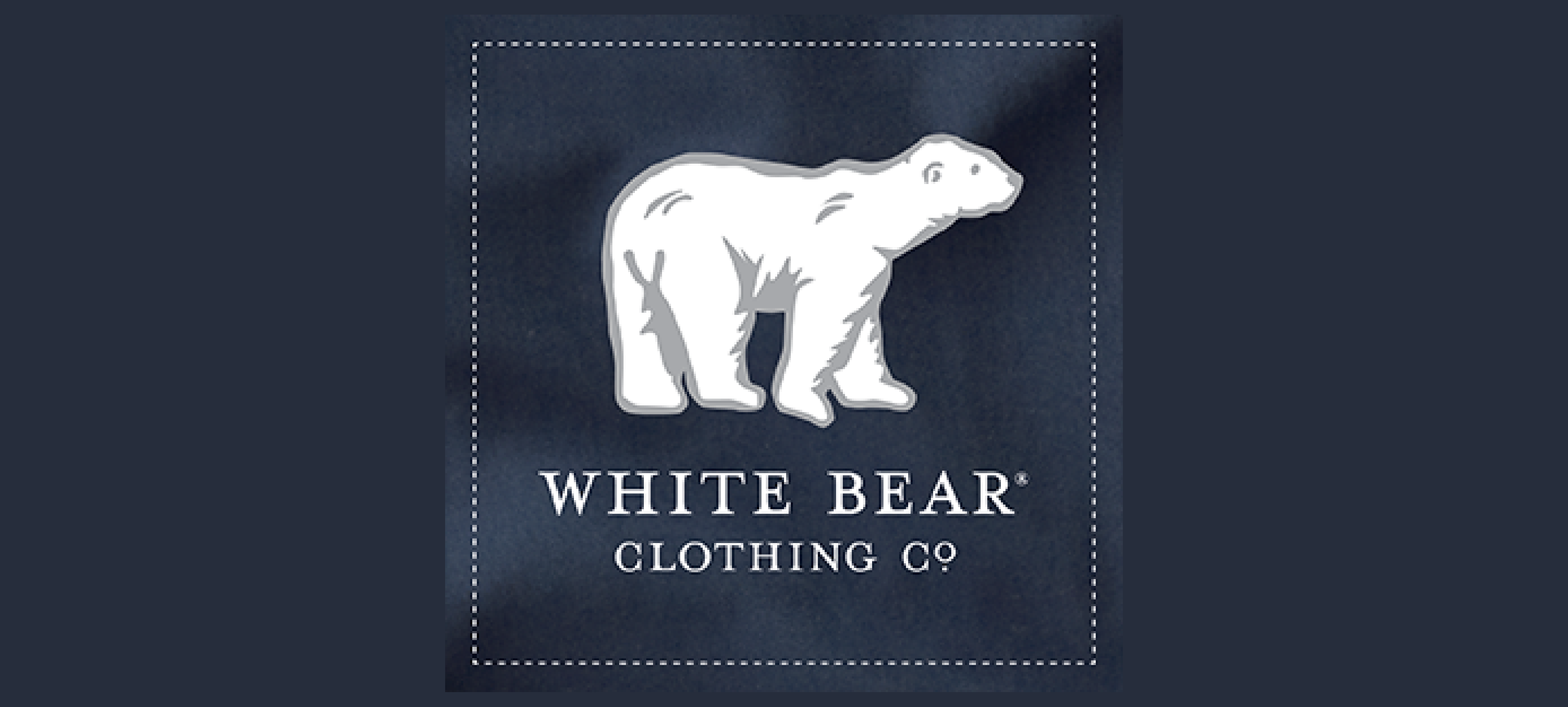 white polar bear on a navy blue background with white lettering that says white bear clothing co