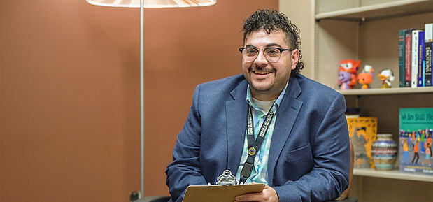 Indian Health Care Resource Centers behavioral health provider smiling while talking with patient.